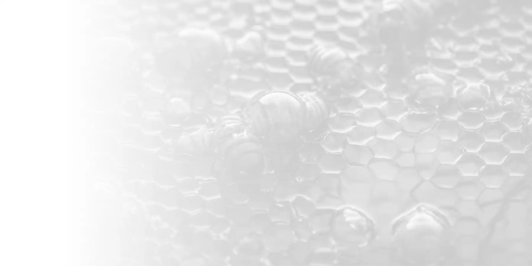 Honeycomb surface with water droplets.